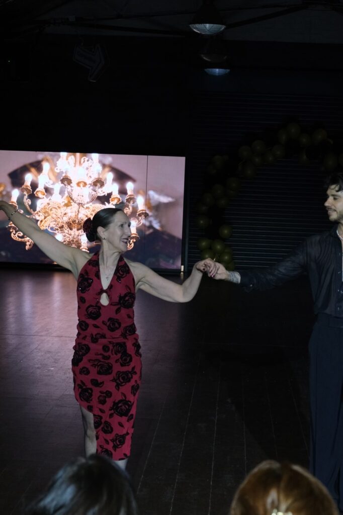 A student dancing Cha Cha Cha with a professional at Dance Amore