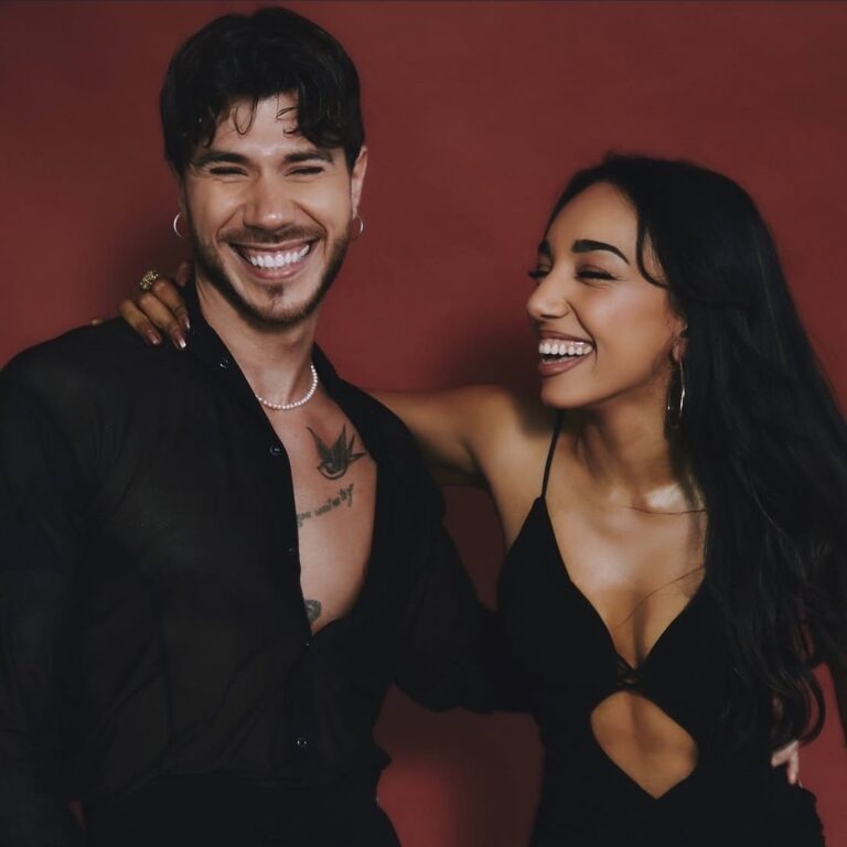 A couple laughing together during a dance lesson at Dance Amore